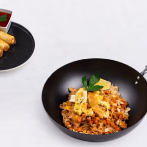 Pad Thai and vegetable spring roll with chili sauce